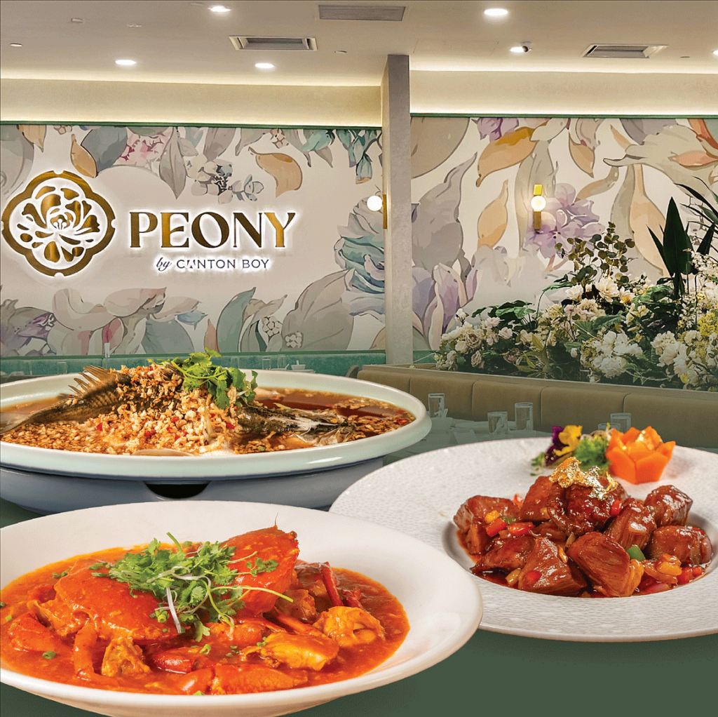A luxurious Chinese restaurant, PEONY by Canton Boy, with a floral-themed interior, soft ambient lighting, and elegant seating. In the foreground, three signature dishes are displayed: a vibrant chili crab in rich sauce, a steamed whole fish topped with garlic and chili, and braised meat stir-fried with colorful peppers. The setting highlights a fine dining experience with premium Cantonese cuisine.